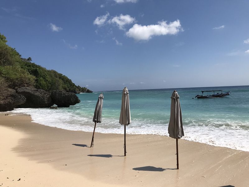Padang Padang Beach, a white-sand cove beneath the Uluwatu cliffs on the Bukit Peninsula, Bali