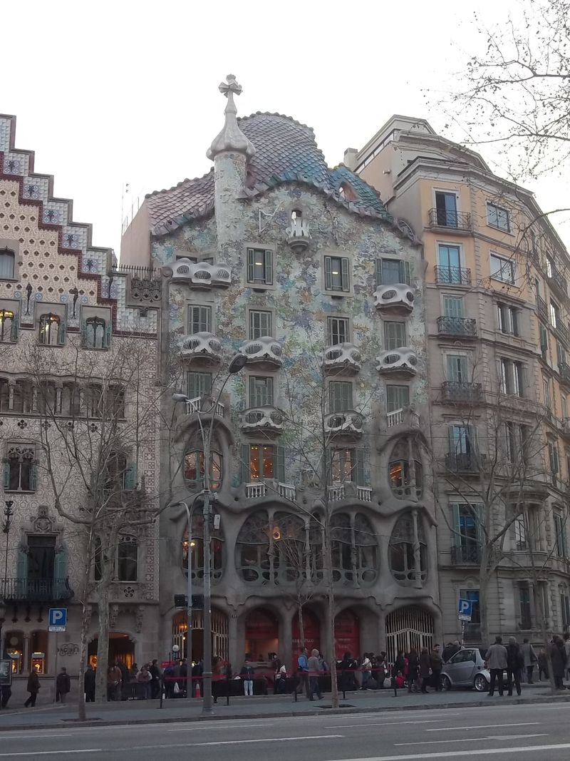 The undulating broken-tile facade and bone-like balconies of Gaudí's Casa Batlló on Passeig de Gràcia, Barcelona