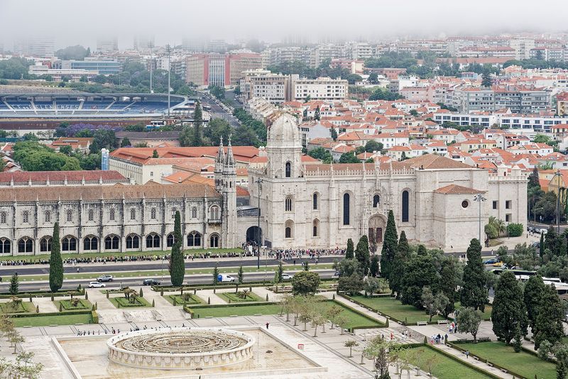 The long Manueline façade of the Mosteiro dos Jerónimos above its formal gardens in Belém, Lisbon