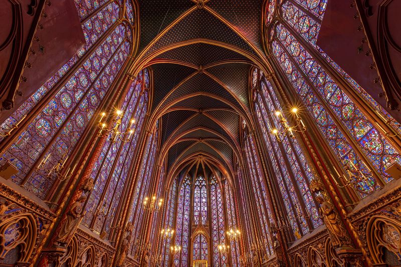 The soaring stained-glass windows and vaulted ceiling of the upper chapel of Sainte-Chapelle, Paris