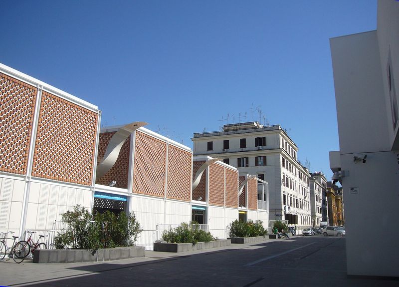The modern covered Nuovo Mercato di Testaccio, its terracotta-block facade and MERCATO TESTACCIO sign facing the street in Rome