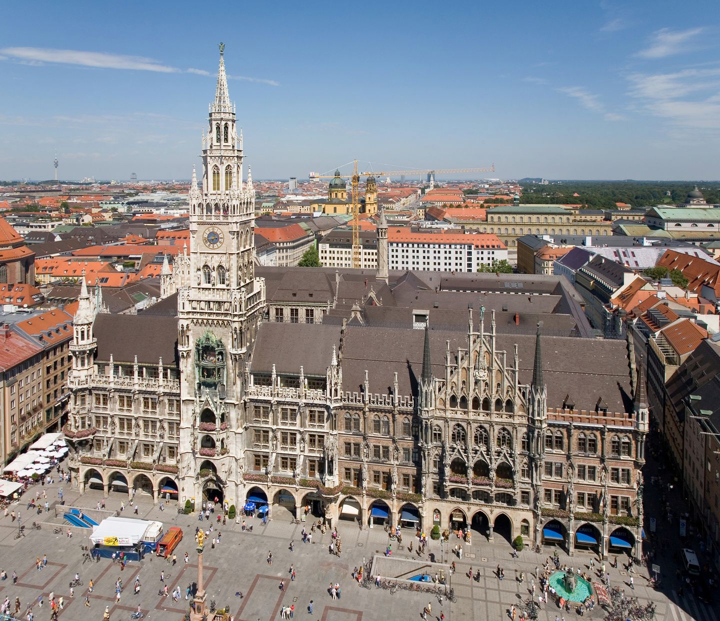 The neo-Gothic tower and facade of Munich's Neues Rathaus rising over the cobbled expanse of Marienplatz, seen from the tower of St. Peter's Church